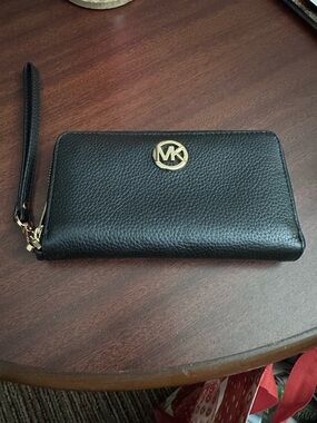 Micheal Kors black wristlet.